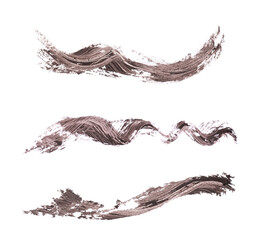 Strokes of brown mascara isolated on white, set. Top view