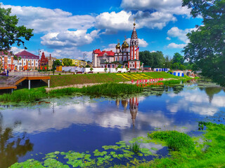 Obraz premium Gusev, Kaliningrad region, Russia July 04 2020 Temple memorial to All Saints and main square on the Pissa river