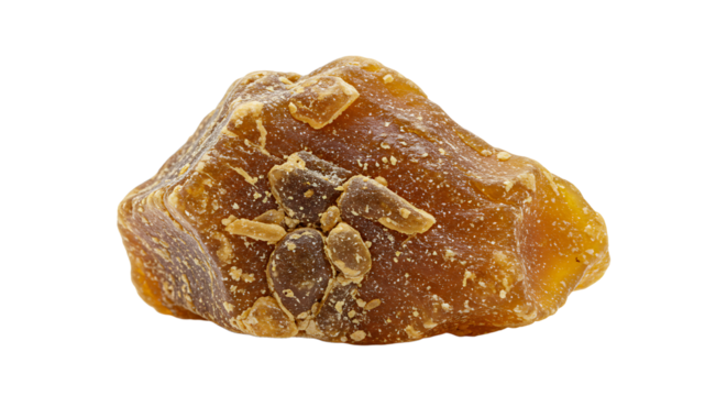 Close up of single block palm sugar jaggery with added pieces