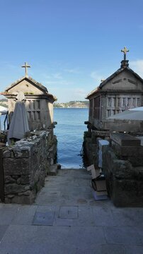 Combarro, horreos and stone crosses overlooking peaceful water in galicia, spain