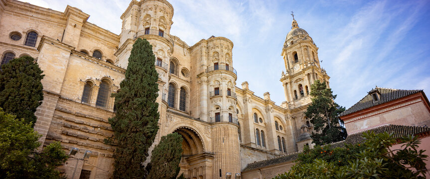 Detail of La Manquita cathedral side entrance richly decorated church in Malaga, Spain. Architectural detail and Andalusian cultural heritage