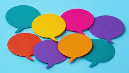 Colorful speech bubbles illustrate linguistic diversity. Many colorful speech bubbles overlap. Represent global communication. Conversation, dialogue between different cultures. Image shows