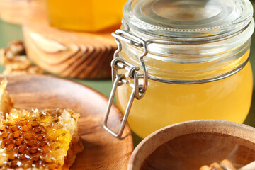 Jar of sweet honey on table, closeup