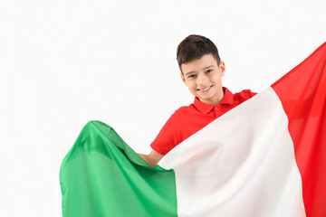 Little boy with flag of Italy on light background
