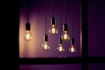 Stylish Pendant Lights Hanging Elegantly Against a Purple Background with Soft Glowing Warmth