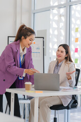 Fototapeta premium Businesswomen Collaborating in Modern Office