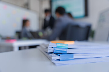 Stack of Documents in Office Meeting