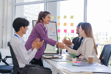 Business Team Handshake in Modern Office