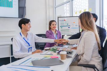 Fototapeta premium Business Team Stacking Hands in Meeting