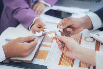 Business Team Assembling Jigsaw Puzzle Pieces