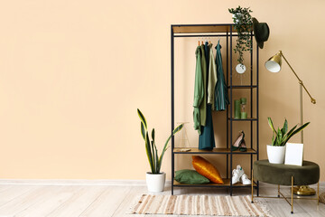 Interior of stylish hall with shelving unit and pouf