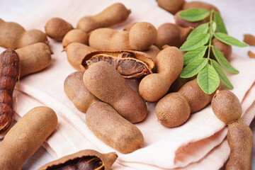 Heap of tasty tamarinds on white background