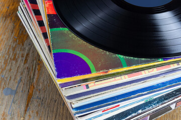 Fototapeta premium Stack of Vinyl Records with Album Covers