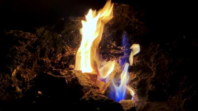 A fire on the slopes of Mount Chimera due to the accumulation of natural gas in the rocks in Cirali, Turkey. Flames on Mount Chimera rise from the ground. Eternal flame in Ancient Lycia. 4K