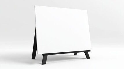 Blank canvas on black wooden easel in minimalist white studio