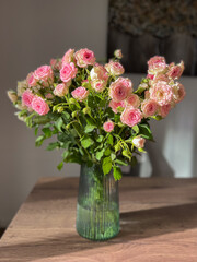 Exquisite Pink Roses in a Charming Glass Vase, Perfect for Any Occasion or Celebration