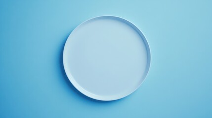Perfectly round white plate placed on a seamless background, exuding elegance and simplicity.