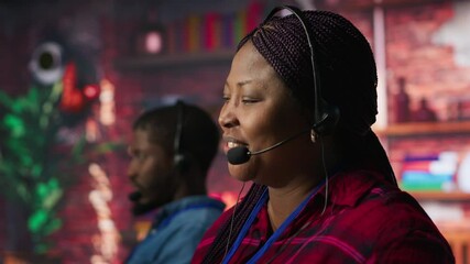 Smiling call center employee handling customer concerns, doing complaint resolution. Persuasive customer service agent contacts clients to inform them about new products, doing upselling camera A