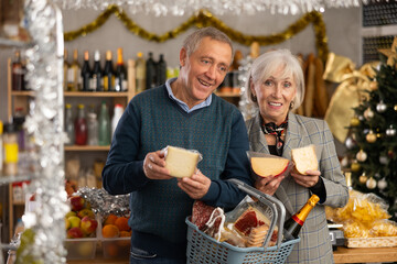 Visiting store on New Years Eve, elderly couple buys cheese. Husband consults with wife, they decide on choice of cheese, consider various varieties of aged cheese