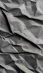 Obraz premium Charcoal-colored wrinkled paper backdrop - rich texture, dark hue, refined design, textured surface, black tone, intricate folds, minimalist aesthetic, paper backdrop, smooth finish, artistic depth.