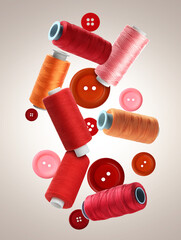 Spools of colorful sewing threads and buttons falling on beige gradient background