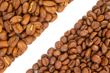Roasted coffee beans in light and dark brown tones, arranged on a white surface, emphasizing their natural texture and split lines. Great for beverage photography.