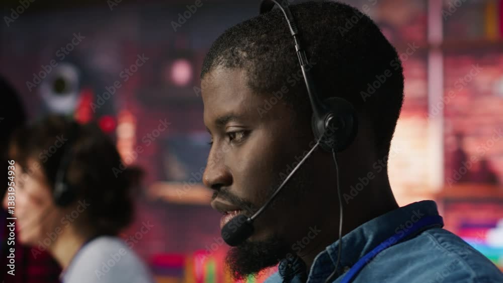 Poster smiling call center agent dealing with unhappy customers, speaking with them using audio headset at 