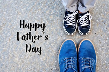 Two pairs of shoes suggest a heartwarming moment between a father and child, celebrating their unique connection on a joyful day dedicated to appreciating parenthood.
