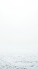 Tranquil misty seascape with overcast sky and gentle waves