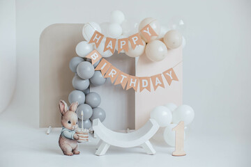 birthday decor with balloons, painted bunny and number 1

