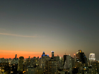 Nighttime Skyline of Benchakitti Park and Urban Buildings