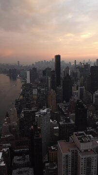Sunset aerial view to Manhattan Midtown and Downtown at sunset time in New York City
