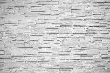 Gray stone cladding wall decoration texture as background.