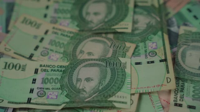 Close-up of Paraguayan currency bills
