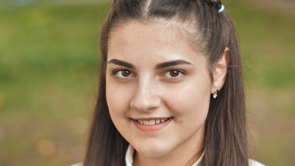 Portrait of a smiling 16 year old girl. Face close up.