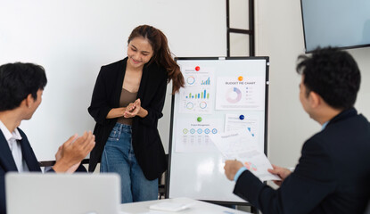 Engaging Presentation and Positive Response. A young woman enjoys the interaction after sharing insights.