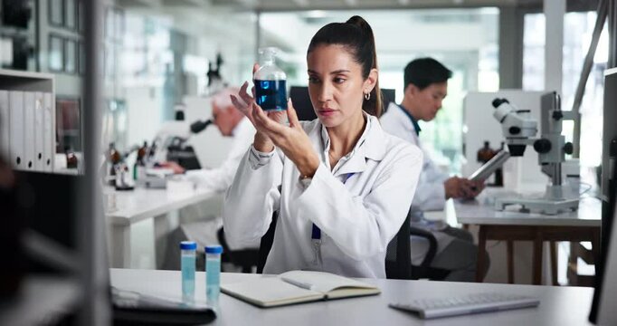 Woman, scientist and beaker with sample at lab for progress with report, notes and planning. Mature person, notebook and test tube with liquid, chemical and medical research for pharmaceutical study