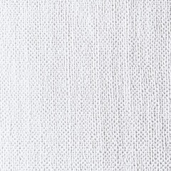 Textured white fabric surface with detailed knit pattern close-up