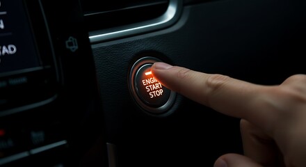 Pressing Engine Start Stop Button in Modern Car Interior