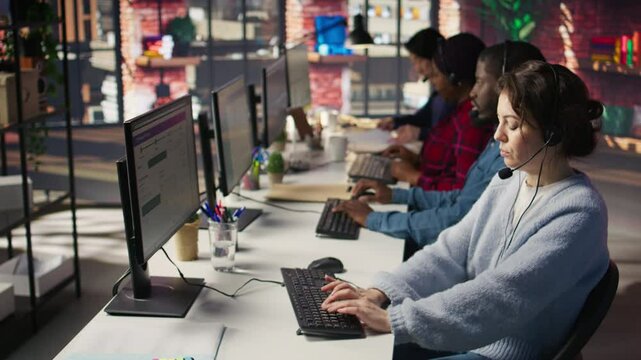 Customer support workers assisting clients to meet outbound call quotas and sales targets. Call center agents contacting prospects to inform them about new products, camera B