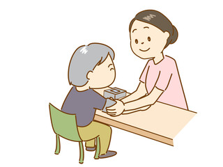 血圧測定をする看護師