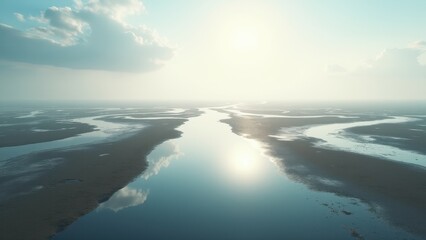 Fototapeta premium Aerial view of winding river delta at sunrise with calm water and soft light 
