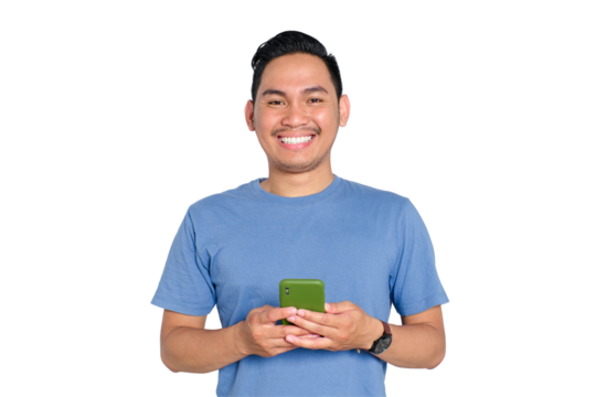 Smiling young Asian man holding smartphone and looking at camera, feeling happy and relaxed, isolated on transparent background