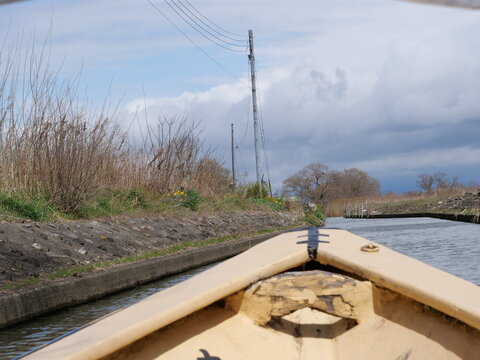View from a small boat traveling along a calm river