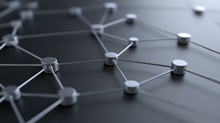 Close-up of interconnected network nodes on dark surface, symbolizing digital connectivity and communication.