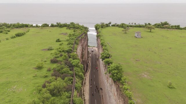 Aerial view of Tanah Barak&rsquo;s majestic cliffs leading to the hidden Pandawa Beach in Bali, Indonesia. Stunning coastal scenery with rugged rock formations and untouched natural beauty.
