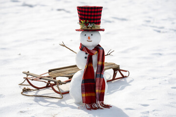 Snowman winter background. Winter holiday scene. Snowman with scarf and hat. Winter design. Happy snowman outdoor. New year banner. Frosty snowman. Winter greeting postcard. Cute snow man.