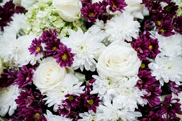 yellow and white roses and then there are beautiful white orchids.