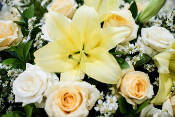 yellow and white roses and then there are beautiful white orchids.