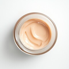 Light beige cream in a clear glass jar